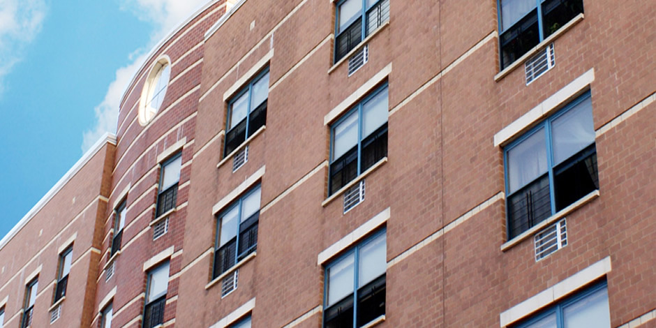 Window guard installation on a midrise city building